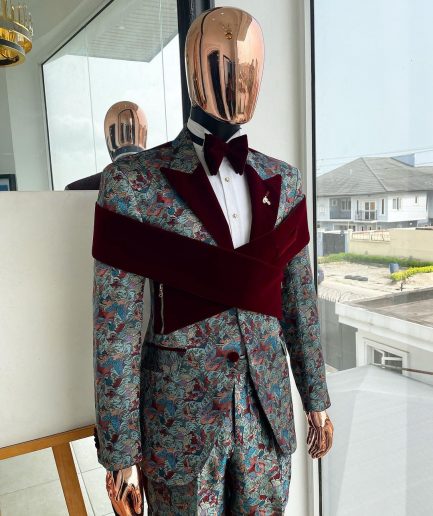 An “octopus” floral paisley tuxedo with intersected mahogany red soaked Italian velvet peak lapel suit