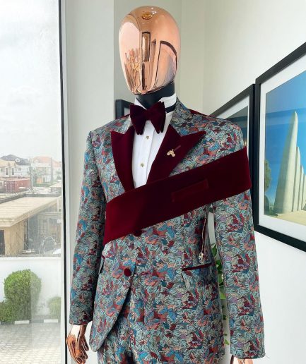 An “octopus” floral paisley tuxedo with left side strap mahogany red soaked Italian velvet peak lapel suit