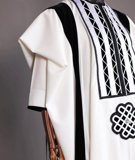 A Reloaded white Monochrome embroidery with charcoal black soaked Italian velvet detailing agbada