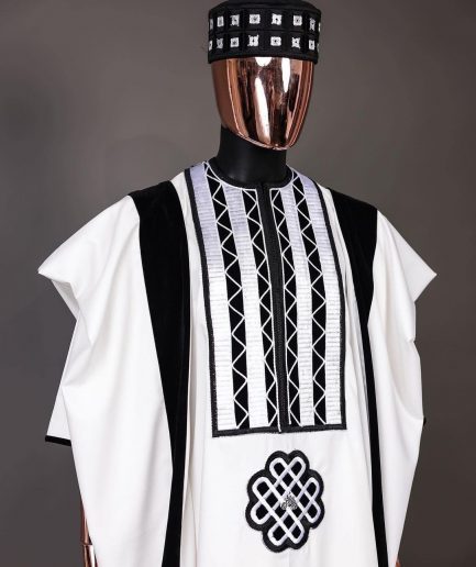 A Reloaded white Monochrome embroidery with charcoal black soaked Italian velvet detailing agbada