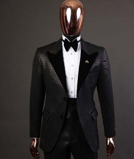 A Charcoal black inverted square patterned metallic jacquard tuxedo with charcoal black velvet peak lapel suit