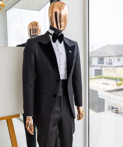 A Charcoal black inverted square patterned metallic jacquard tuxedo with charcoal black velvet peak lapel suit