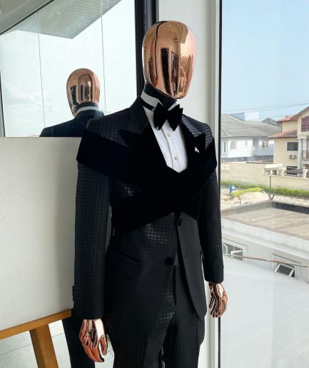 An “Octopus” black inverted square patterned metallic jacquard tuxedo with intersected black velvet peak lapel suit