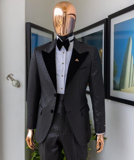 A Charcoal black inverted square patterned metallic jacquard tuxedo with charcoal black velvet peak lapel suit