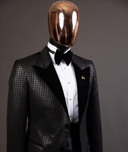 A Charcoal black inverted square patterned metallic jacquard tuxedo with charcoal black velvet peak lapel suit