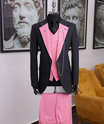 A charcoal black “contrast” pink notch lapel suit