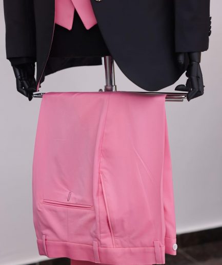 A charcoal black “contrast” pink notch lapel suit