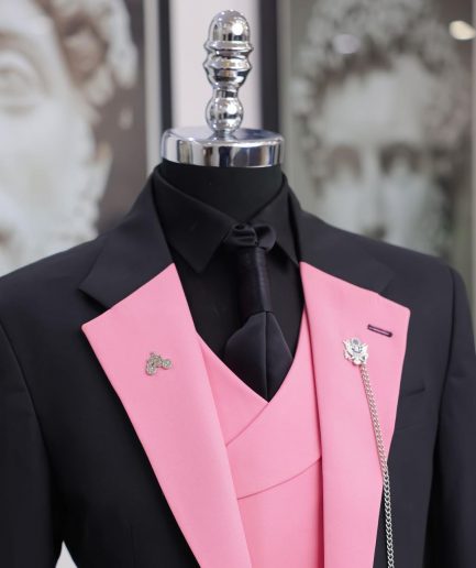 A charcoal black “contrast” pink notch lapel suit