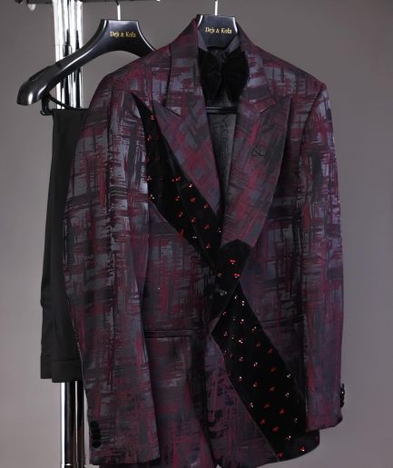 A diagonal cut layered black velvet Swarovski detailing burgundy and black patterned suit