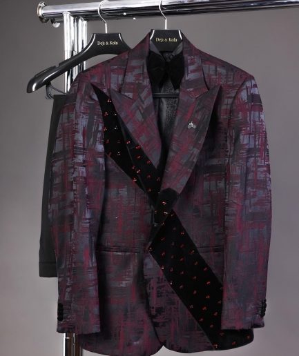 A diagonal cut layered black velvet Swarovski detailing burgundy and black patterned suit