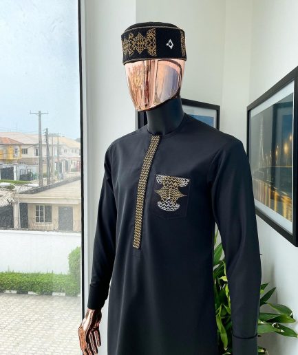 A charcoal black, dotted flap, kissing wave embroidery detailing hat and flap pocket traditional senator kaftan native