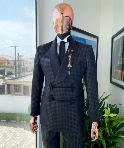 A “sajora” black inverted square patterned jacquard tuxedo suit