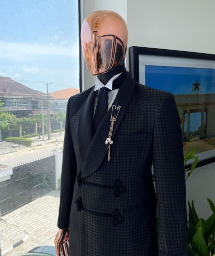 A “sajora” black inverted square patterned jacquard tuxedo suit