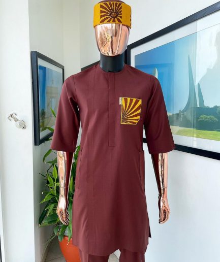 A Cinnamon brown, sunset in the east embroidery detailing hat and patch pocket traditional senator kaftan native.