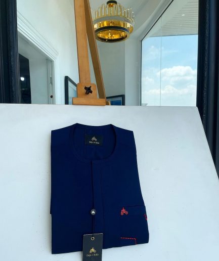 A Navy blue front flap and red lane pocket detail Senator Kaftan native