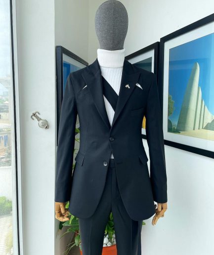 A “power” front and back slit charcoal black, long cross strap peak lapel suit
