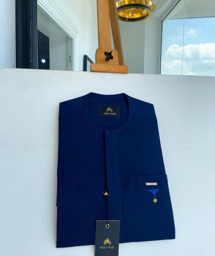A Navy blue, front flap and slant pocket with inverted tree detailing senator kaftan native.