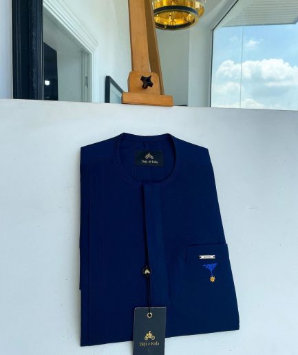 A Navy blue, front flap and slant pocket with inverted tree detailing senator kaftan native.