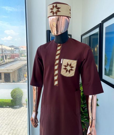 A cinnamon brown, sunrise in the east embroidery detailing hat & patch pocket traditional senator kaftan native.