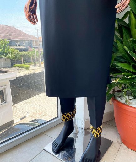 A charcoal black dagbtan, connected star gold embroidery detailing senator native.