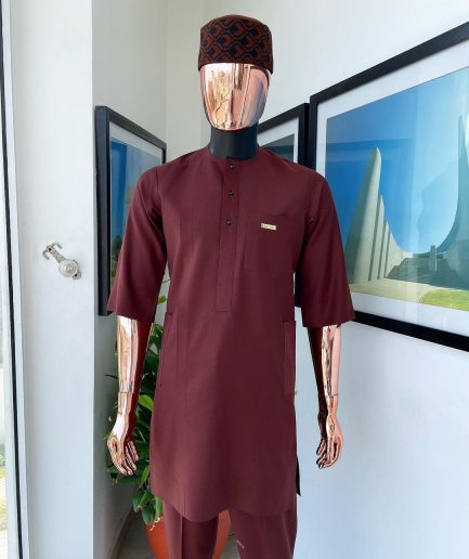 A cinnamon brown 3/4 sleeve kaftan, Swarovski buttons flap, and layered eggplant embroidery hat detail traditional senator kaftan native
