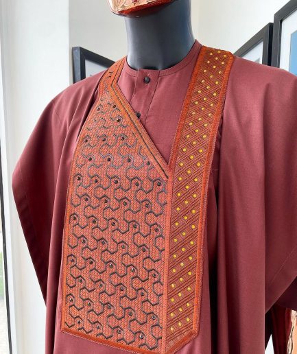 A Cinnamon brown spiral binding embroidery detailing with black and gold ss20 Swarovski stud agbada
