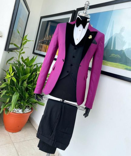A Magenta, one button, peak lapel tuxedo jacquard suit.