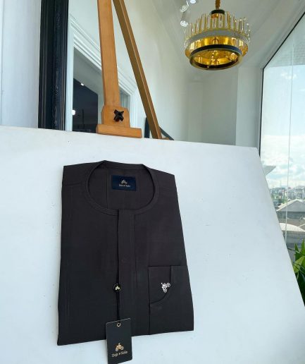 An Umber Brown, Front Flap and Undulating Lift Patch Pocket Detailing Senator Kaftan Native.