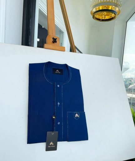 An Egyptian blue, front flap, patch pocket, matching Swarovski buttons, paisley detailing African senator kaftan native.