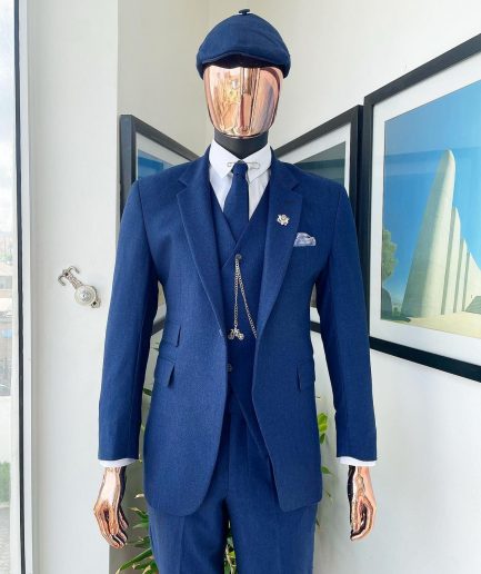 A navy blue “peaky blinders” - Jorgecarli super 140’s- “Board Room” notch lapel suit