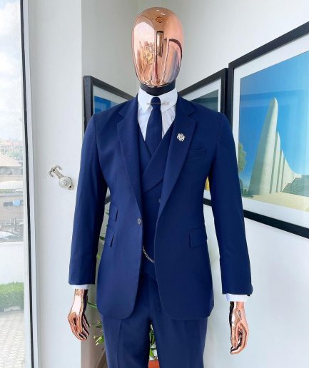 A navy blue - layered square patterned - Jorgecarli super 140’s- “Board Room” notch lapel suit