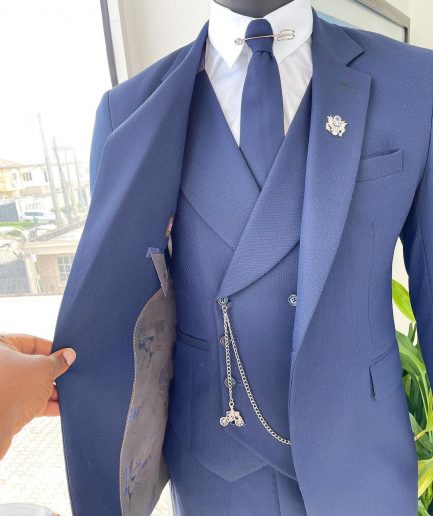 A navy blue - layered square patterned - Jorgecarli super 140’s- “Board Room” notch lapel suit