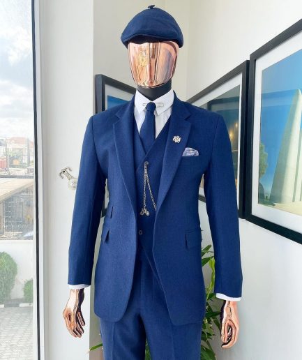 A navy blue “peaky blinders” - Jorgecarli super 140’s- “Board Room” notch lapel suit