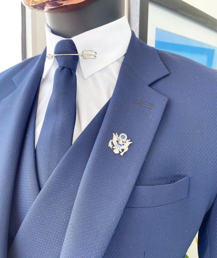 A navy blue - layered square patterned - Jorgecarli super 140’s- “Board Room” notch lapel suit