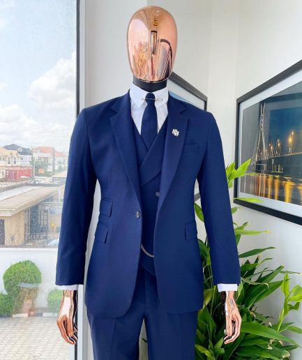 A navy blue - layered square patterned - Jorgecarli super 140’s- “Board Room” notch lapel suit