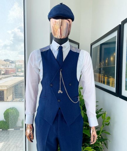 A navy blue “peaky blinders” - Jorgecarli super 140’s- “Board Room” notch lapel suit