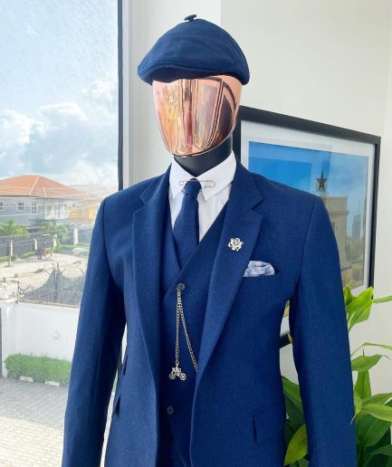 A navy blue “peaky blinders” - Jorgecarli super 140’s- “Board Room” notch lapel suit