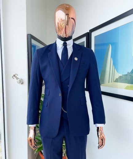 A navy blue - layered square patterned - Jorgecarli super 140’s- “Board Room” notch lapel suit