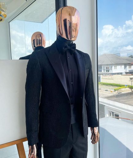 A monochrome charcoal black, peak lapel, metallic Jacquard tuxedo suit.