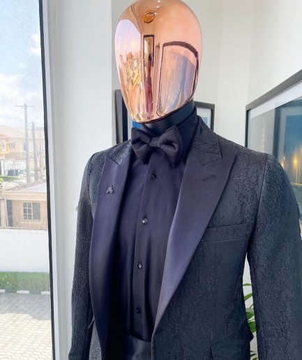 A monochrome charcoal black, peak lapel, metallic Jacquard tuxedo suit.