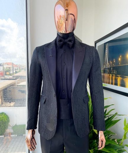 A monochrome charcoal black, peak lapel, metallic Jacquard tuxedo suit.
