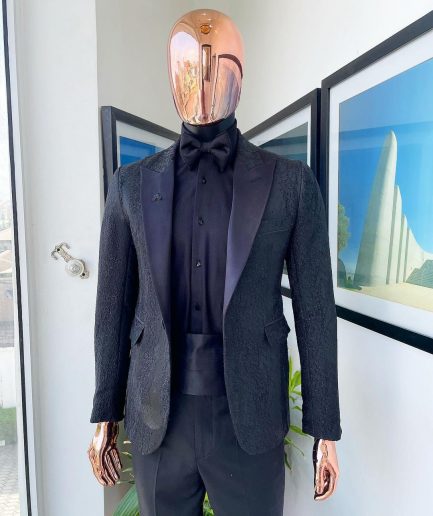 A monochrome charcoal black, peak lapel, metallic Jacquard tuxedo suit.