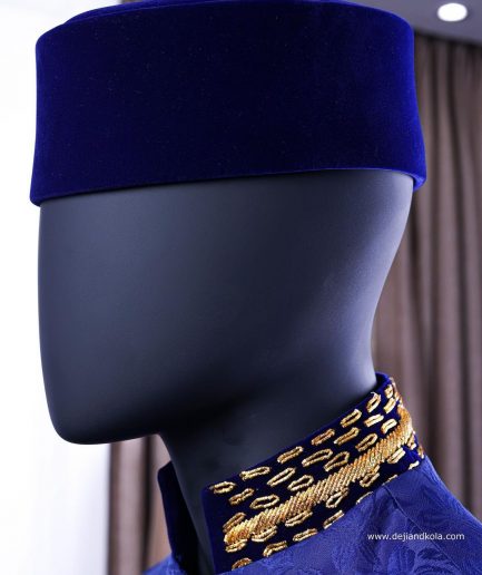 A Navy blue “Prince of Persia” ceremonial tail suit, Gold Metal Wire hand woven embroidery detail mix on velvet