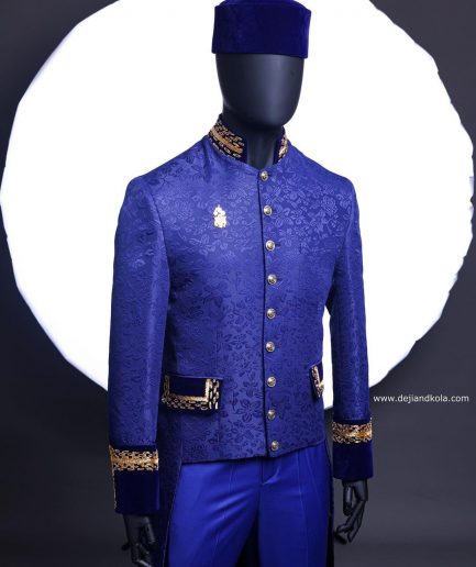 A Navy blue “Prince of Persia” ceremonial tail suit, Gold Metal Wire hand woven embroidery detail mix on velvet