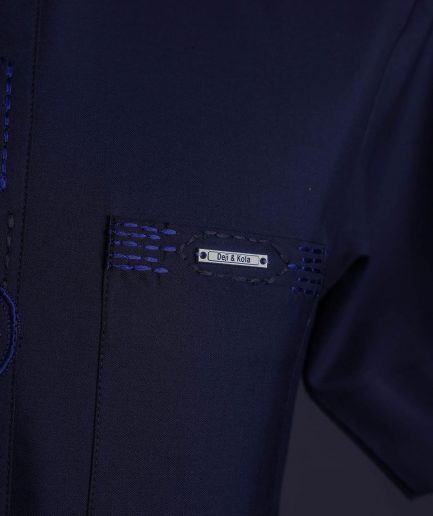 A Navy blue front flap, patch pocket with spiral embroidery detailing African senator Kaftan