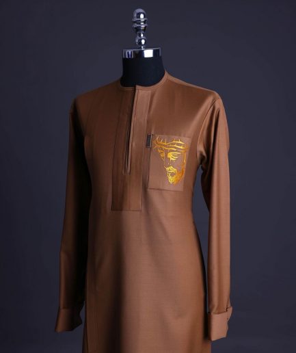 A Gingerbread brown, wide double lane flap, patch pocket with “Golgotha” embroidery detailing African senator kaftan native.
