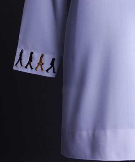A White, front flap with mixed Swarovski buttons, patch pocket, free hand cuff with (keep walking) embroidery detailing African senator kaftan native.