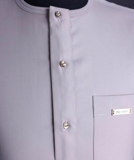 A Porcelain, front flap with gold Swarovski button, patch pocket, 3/4 sleeve African senator kaftan native.