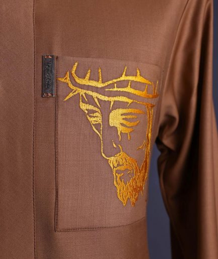 A Gingerbread brown, wide double lane flap, patch pocket with “Golgotha” embroidery detailing African senator kaftan native.