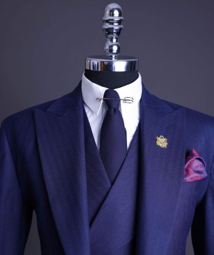 A Navy Blue, Herringbone Nobility Super “140s” “Board Room” Peak Lapel Suit